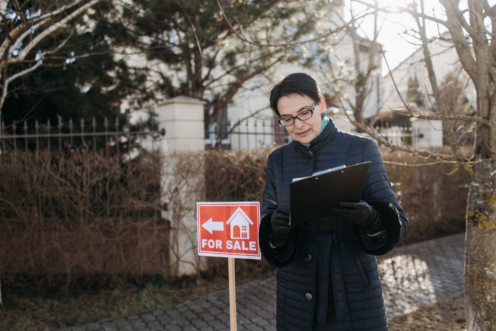 A Keyfinder property manager inspecting a Phoenix rental with a clipboard
